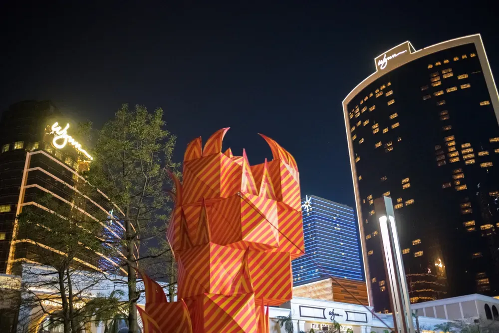 sculptures and buildings at night in macau